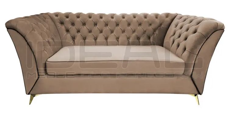 pikowana sofa chesterfield na złotych nóżkach